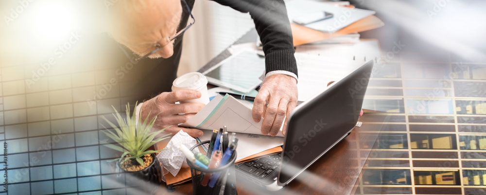 Fototapeta premium Disorganized businessman looking for documents; multiple exposure