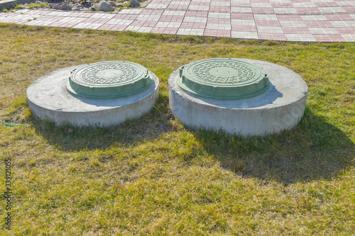 manhole sewer cleaning system on the ground on a Sunny spring day