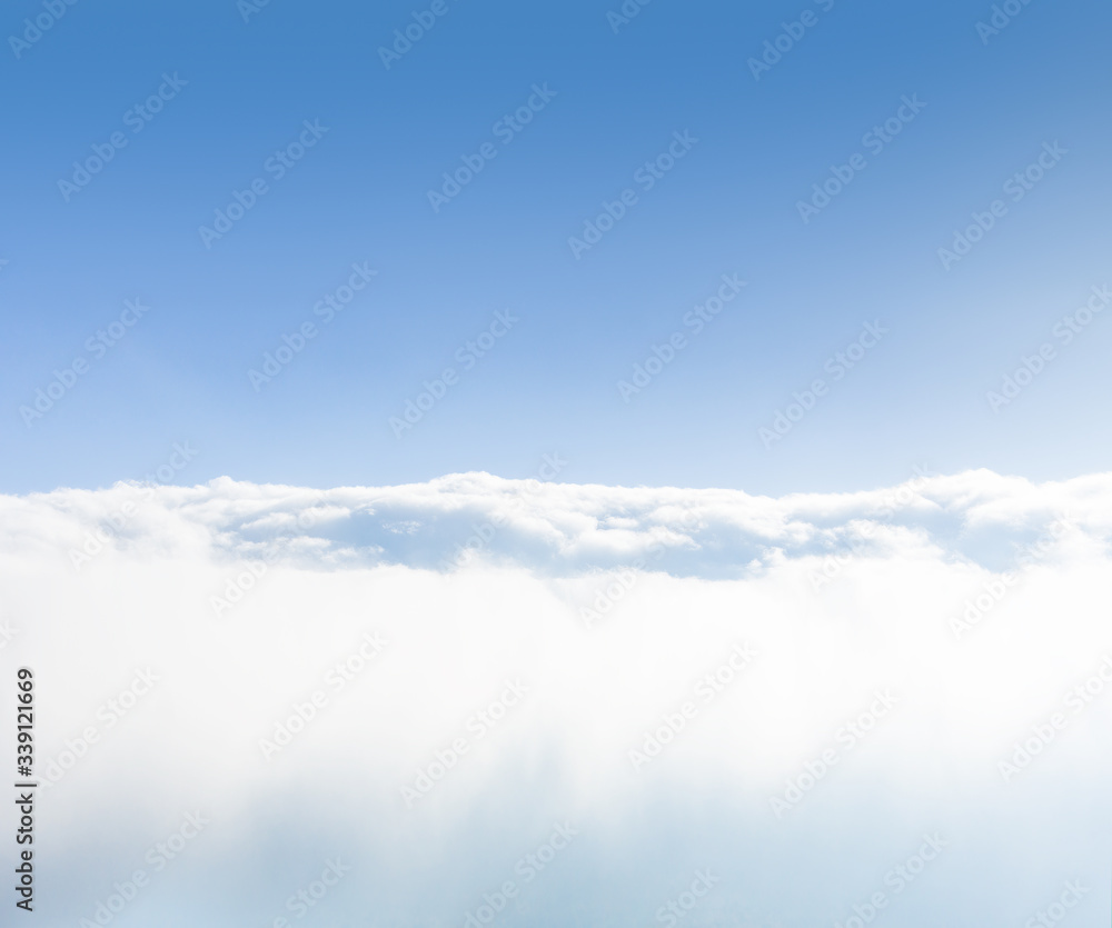 Background of sea of clouds against blue sky