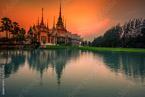 Wallpaper Wat Lan Boon Mahawihan Somdet Phra Buddhacharn(Wat Non Kum)is the beauty of the church that reflects the surface of the water,popular tourists come to make merit and take a public photo © bangprik