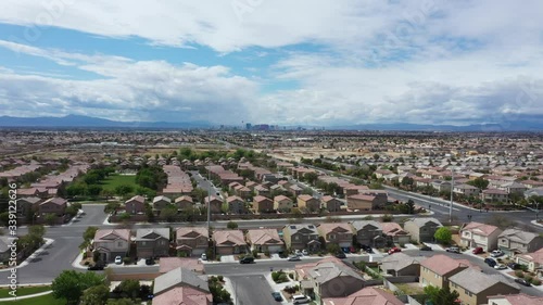 Aerial forward of north Las Vegas city with skyscrapers in background