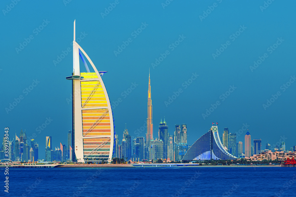 Dubai city center and famous Jumeirah beach skyline at sunset, United Arab Emirates