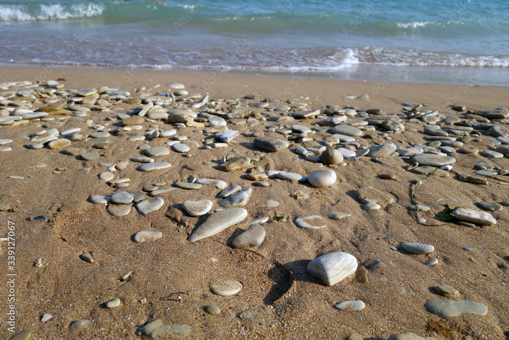 Small stones sand and sea wave. Small stones sand and sea wave.