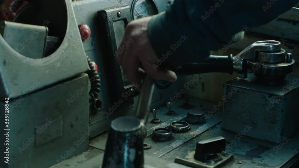 Hand shifting gears train old industrial moody light Hand shifting gears train old industrial moody light