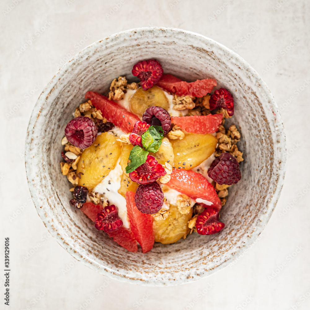 granola with banana and raspberries granola with banana and raspberries