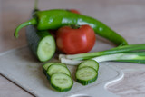 sliced cucumber against the background of vegetables