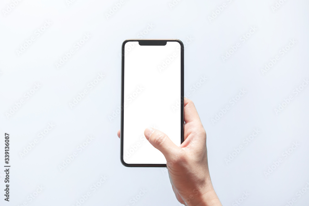 Smartphone mockup. Close up hand holding black phone white screen. Isolated on white background. Mobile phone frameless design concept. - obrazy, fototapety, plakaty 
