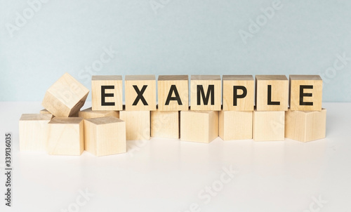 example - cube with letters, sign with wooden cubes photo