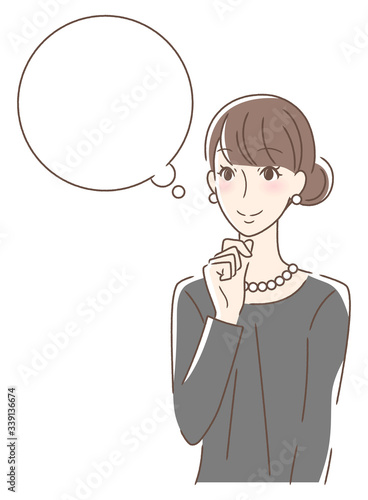 笑顔で想像する女性