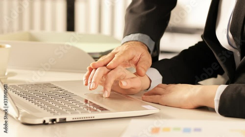 Female executive defending herself from harassment at office