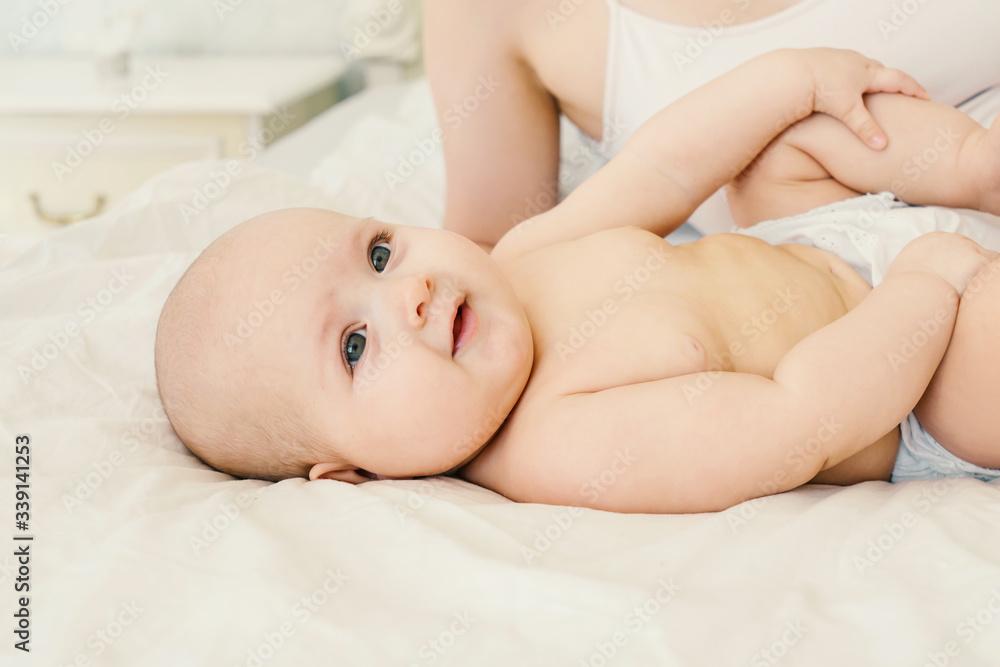 Naked baby on a light background. Naked baby on a light background.