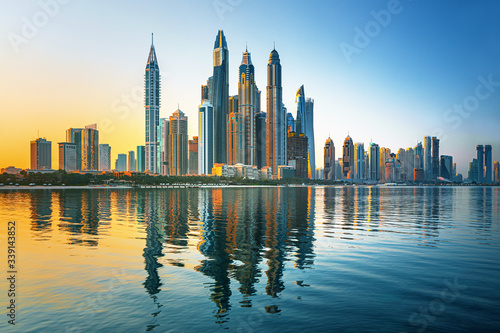 Modern and Luxury Dubai Marina with reflection - famous Jumeirah beach at sunrise  United Arab Emirates