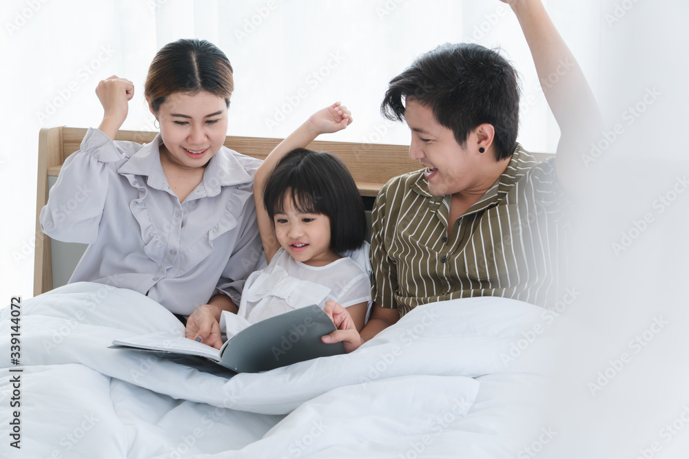 Parents and children are playing in the bedroom Parents and children are playing in the bedroom