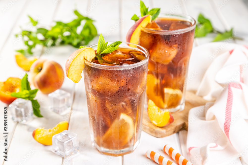 Iced tea and ingredients in glasses on wood background, copy space Iced tea and ingredients in glasses on wood background, copy space