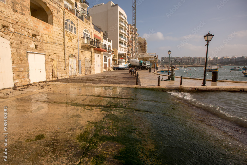 Old yellow fringed doors in Valletta, Malta