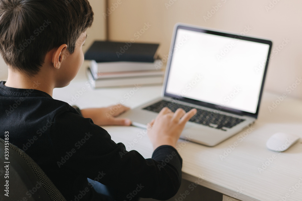 Teenage boy studing on paltip at home. Young boy play online games at home. Study in quarantine. Happy schoolboy during qurantine Teenage boy studing on paltip at home. Young boy play online games at home. Study in quarantine. Happy schoolboy during qurantine