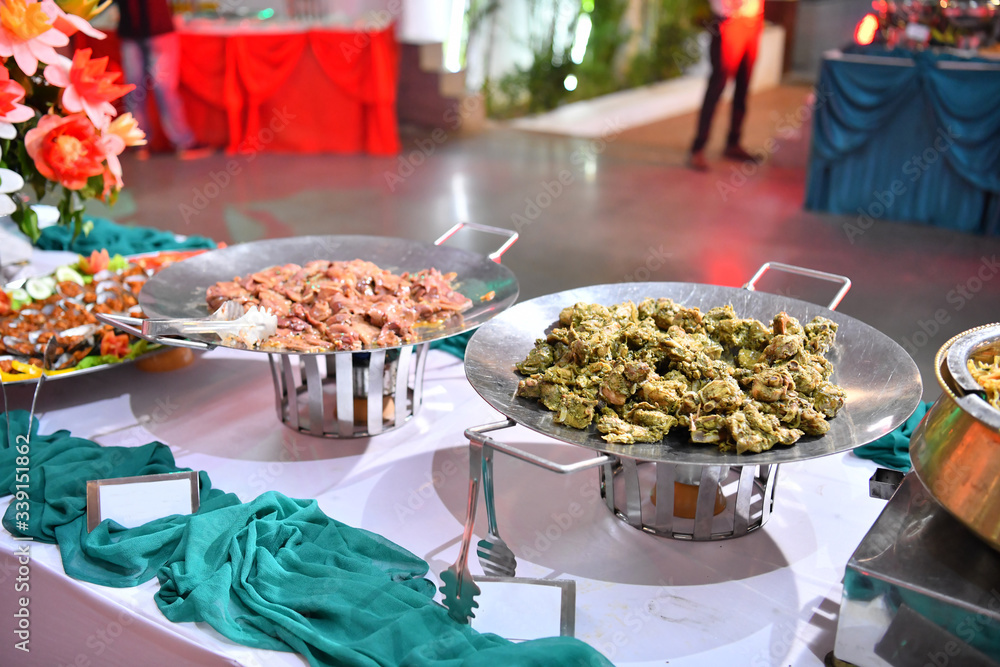 A traditional Indian wedding buffet. Assortment of traditional cuisine at an Asian wedding.