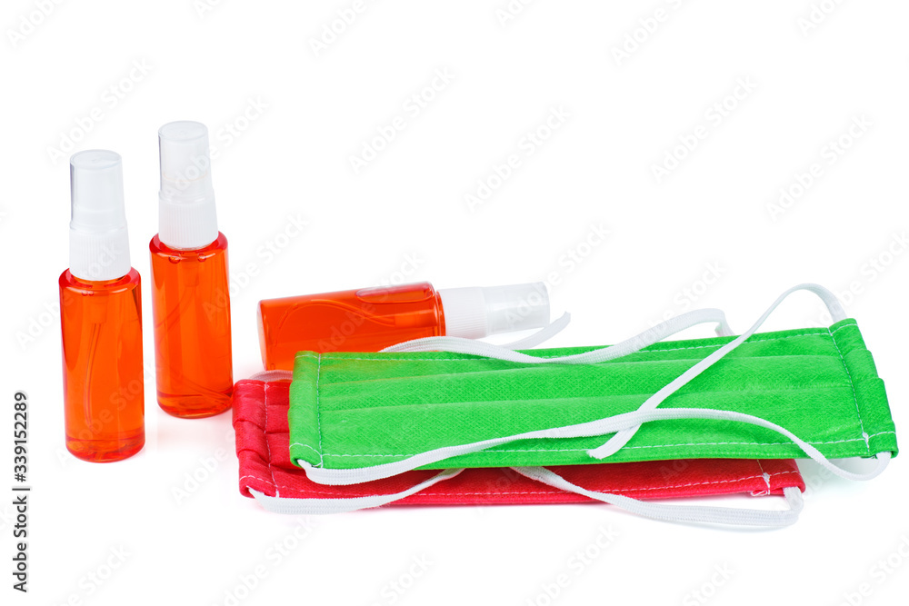 Medical masks and sanitizer on a white background