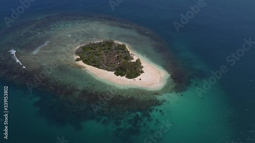 Establishing aerial shot of beautiful, sunlit, tiny island, Cayo Peraza, Morrocoy National Park, Venezuela, South America.  photo