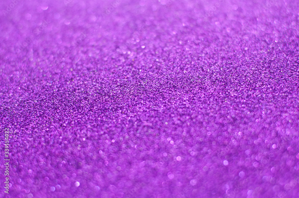 Purple glitter texture abstract background. Shiny glowing colors. Concept of royalty, luxury, power, ambition, creativity or pride. Purple glitter texture abstract background. Shiny glowing colors. Concept of royalty, luxury, power, ambition, creativity or pride.
