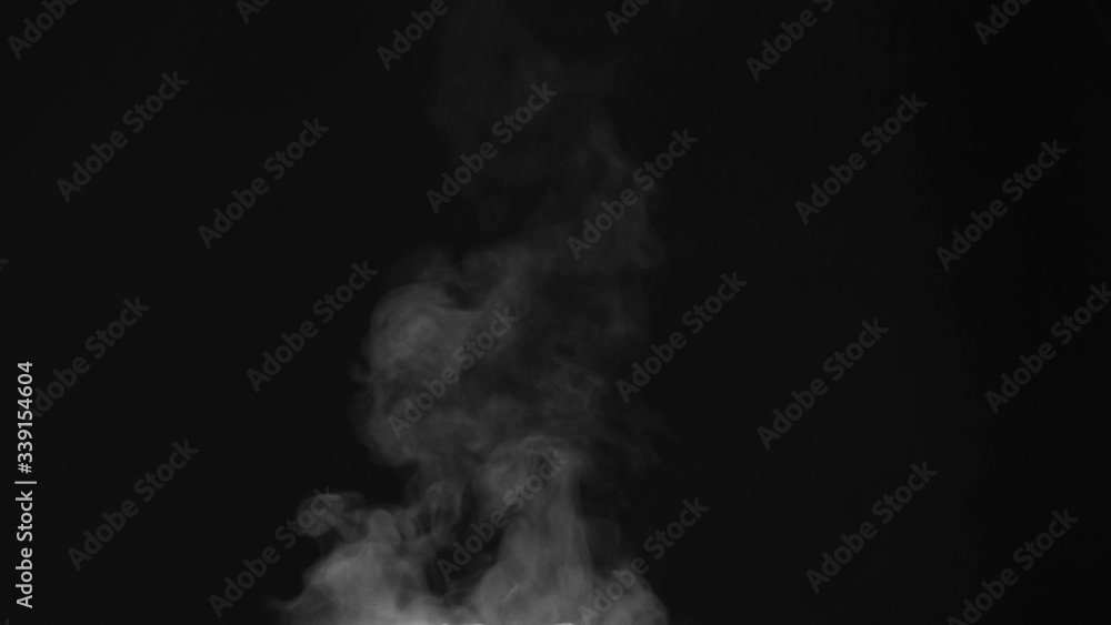 Steam from the Pan with a Fragrant Meal. White Steam rises from a large pot that is behind the scenes. Black background. Filmed at a speed of 240fps Steam from the Pan with a Fragrant Meal. White Steam rises from a large pot that is behind the scenes. Black background. Filmed at a speed of 240fps