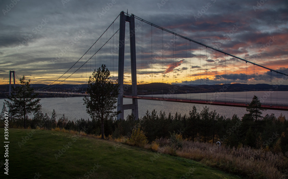 Fototapeta premium Sweden. Large anchor bridge over the sea against the sunset sky