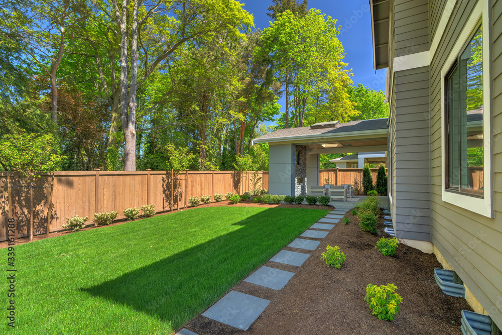 Fantastic new backyard with fresh landscape, fully fenced, with back porch, and large birch trees. Fantastic new backyard with fresh landscape, fully fenced, with back porch, and large birch trees.