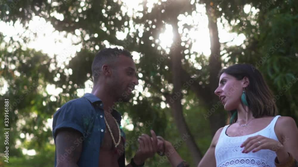 Multiracial couple dancing salsa in a jungle Multiracial couple dancing salsa in a jungle
