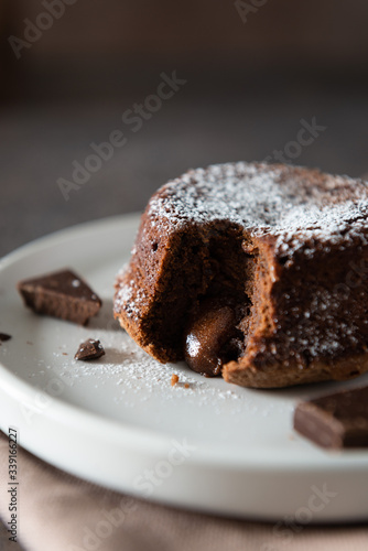 Delicious fresh fondant with hot chocolate centre on the plate. Lava cake recipe, menu. Close up