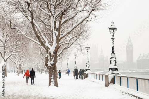 Canvas Print Winter snow covered Thames riverside, London, England, UK