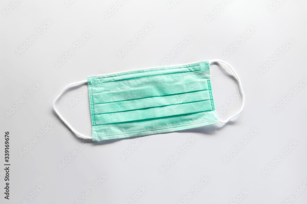 Blue medical mask on a white background Blue medical mask on a white background