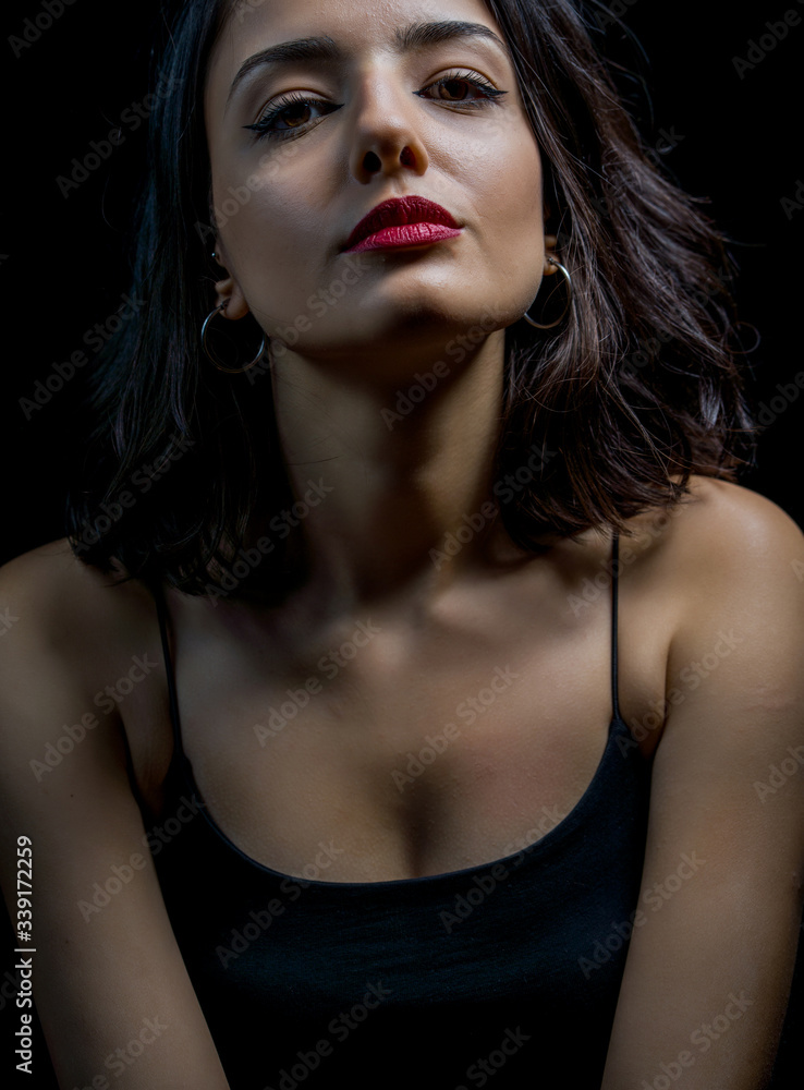 Portrait of beautiful young woman on black background Portrait of beautiful young woman on black background