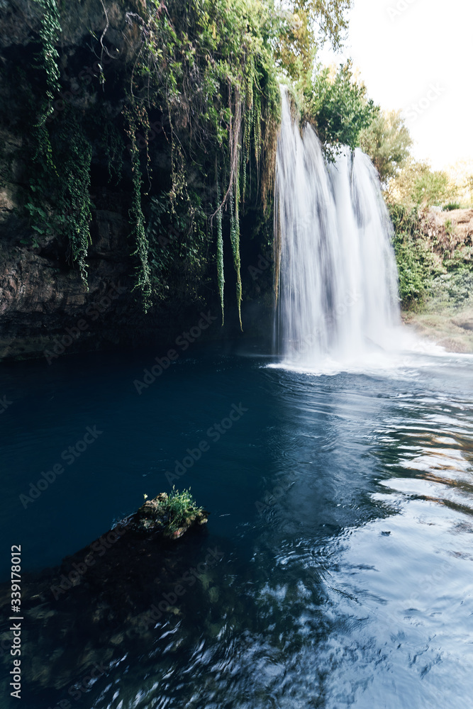 Obraz premium Duden Waterfalls is a famous landmark of Antalya, Turkey. Upper Duden Waterfalls is located in Duden National Park. Water flowing trought the park.