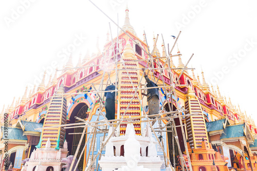 Two man painting a temple