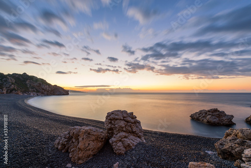 Long exposure sunrise shot of Mavra Volia beach on Chios island in Greece. photo