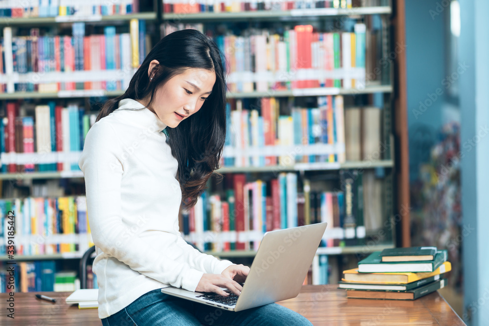 Young beautiful asian student study or work at home and using laptop for online learning.e-Learning education concept.Back to school Young beautiful asian student study or work at home and using laptop for online learning.e-Learning education concept.Back to school