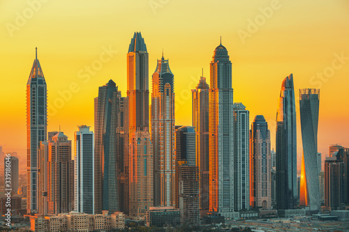 Amazing and Luxury Dubai Marina skyscrapers, famous Jumeirah beach skyscrapers at sunrise, United Arab Emirates
