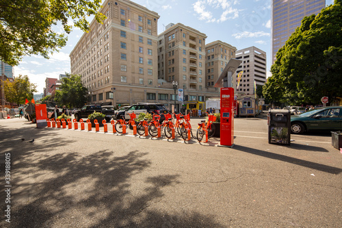 Portland, OR / USA – August 31 2019: Bike sharing program Bike Town in downtown with orange bicycles..