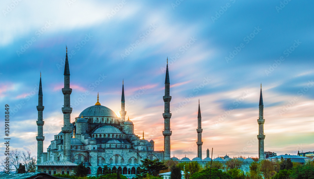 Fototapeta premium Long exposure photo of Blue Mosque at dusk in Istanbul, Turkey; with vibrant colored sky.