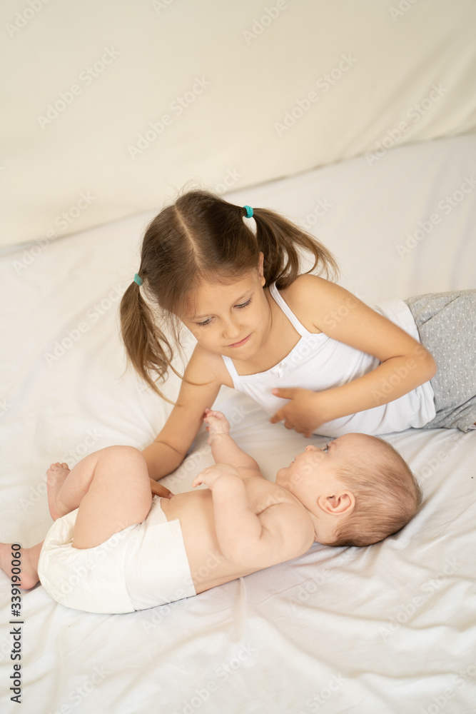Two kids on the bed Two kids on the bed