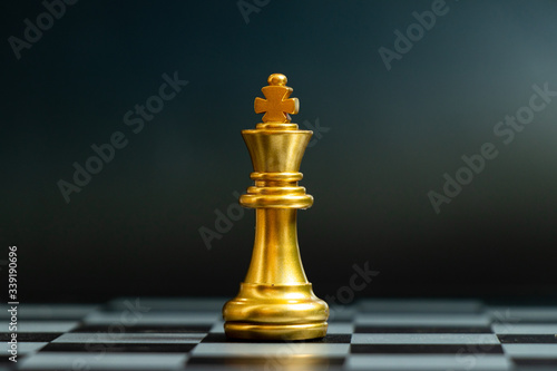 Quadro em tela Gold king chess piece stand on black background (Concept for leadership, unique)