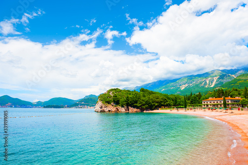 Beautiful beach with turquoise water and cliffs near Budva, Montenegro. Summer seascape, travel and vacation