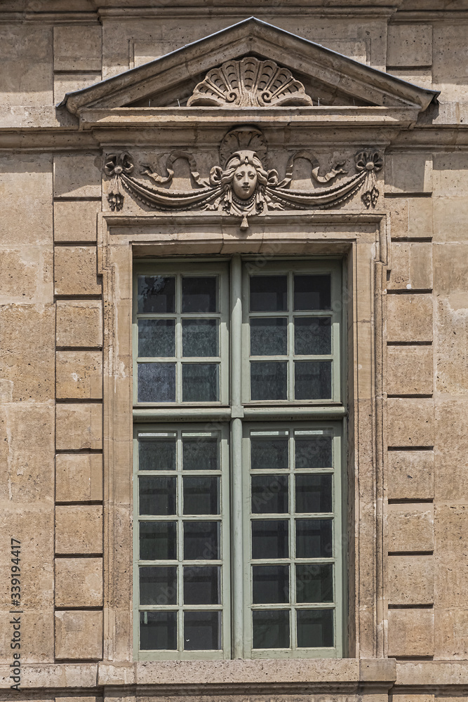 Architectural fragments of Old French house. Saint-Antoine Street, Paris, France.