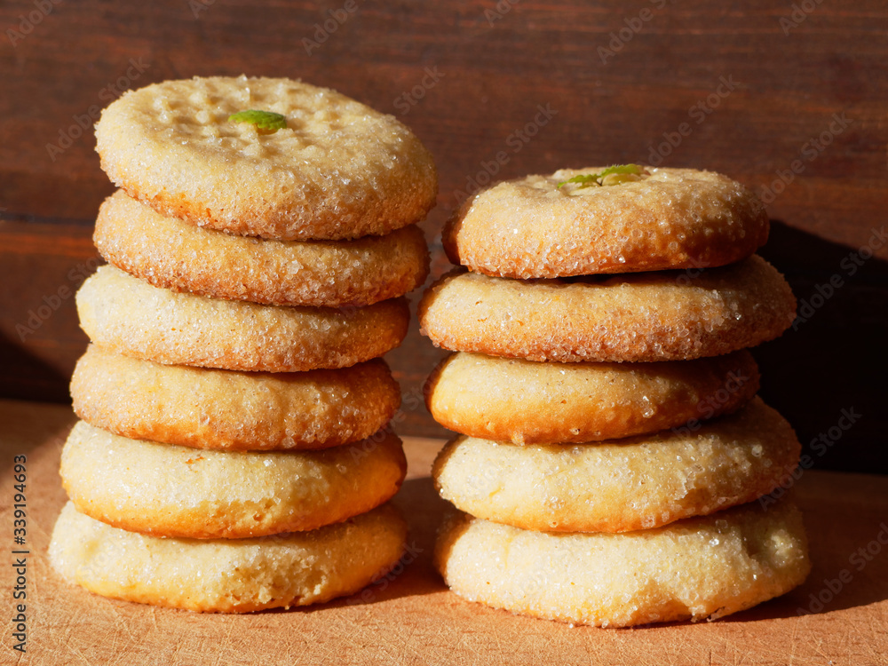 A stack of fresh appetizing cookies on a wooden background. A stack of fresh appetizing cookies on a wooden background.