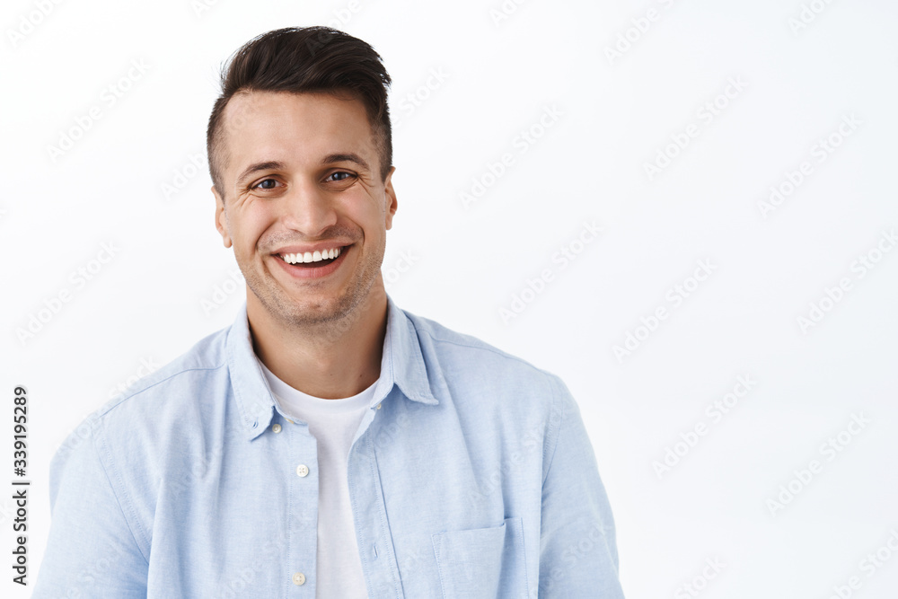 Close-up portrait of handsome adult man with beaming smile, looking camera satisfied, feel upbeat and enthusiastic, standing white background cheerful, enjoying the day, feel excitement