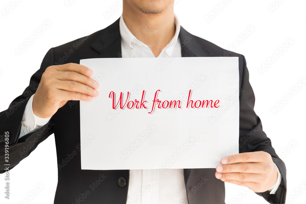 Businessman hold paper with text work from home during covid-19. Businessman hold paper with text work from home during covid-19.