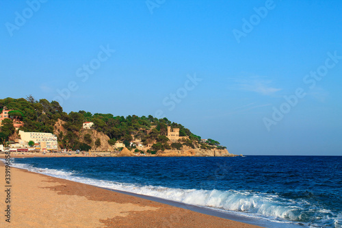 Waves on the beach of Lloret de Mar in the summer. Catalonia  Spain.
