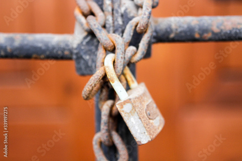 Rusty padlock. Iron chain. Rusty metal.