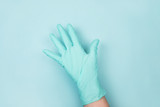 Hand in medical gloves