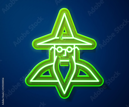 Glowing neon line Wizard warlock icon isolated on blue background.  Vector Illustration